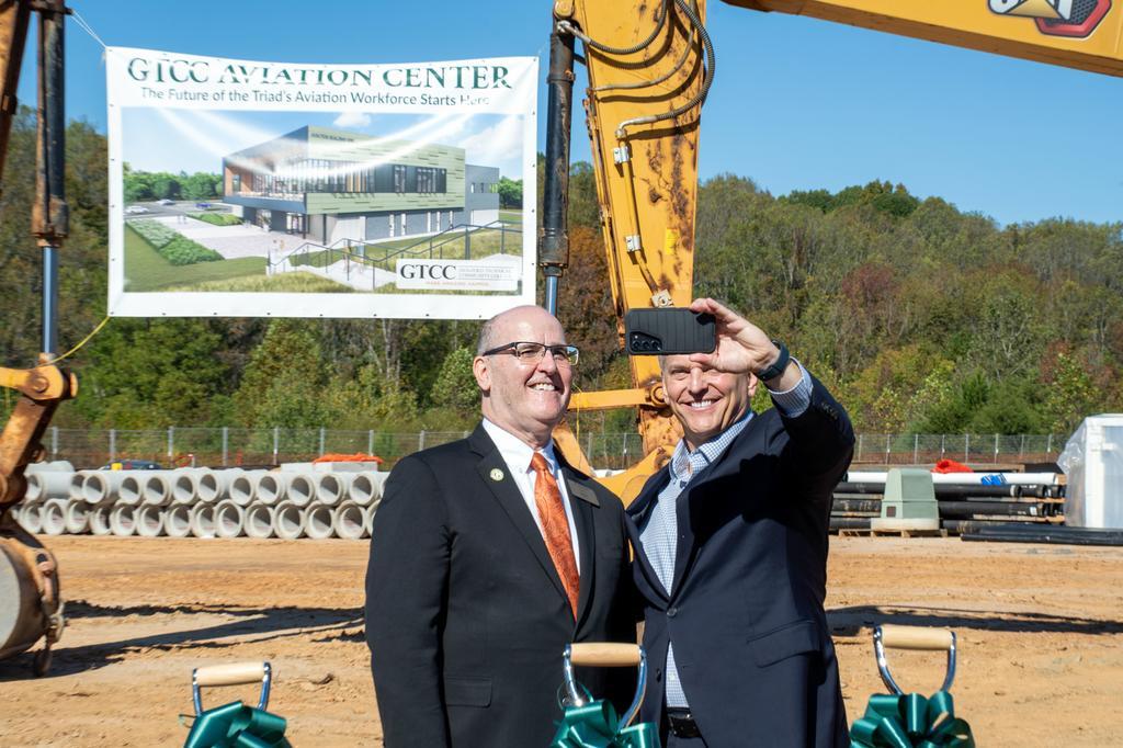 GTCC Aviation Center construction, GTCC president Dr. Anthony Clarke taking a selfie with NC governor Josh Stein