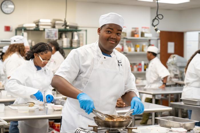 Culinary Curious students working in an industrial kitchen