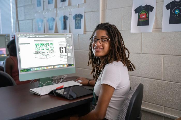 Print Lab student working on a computer