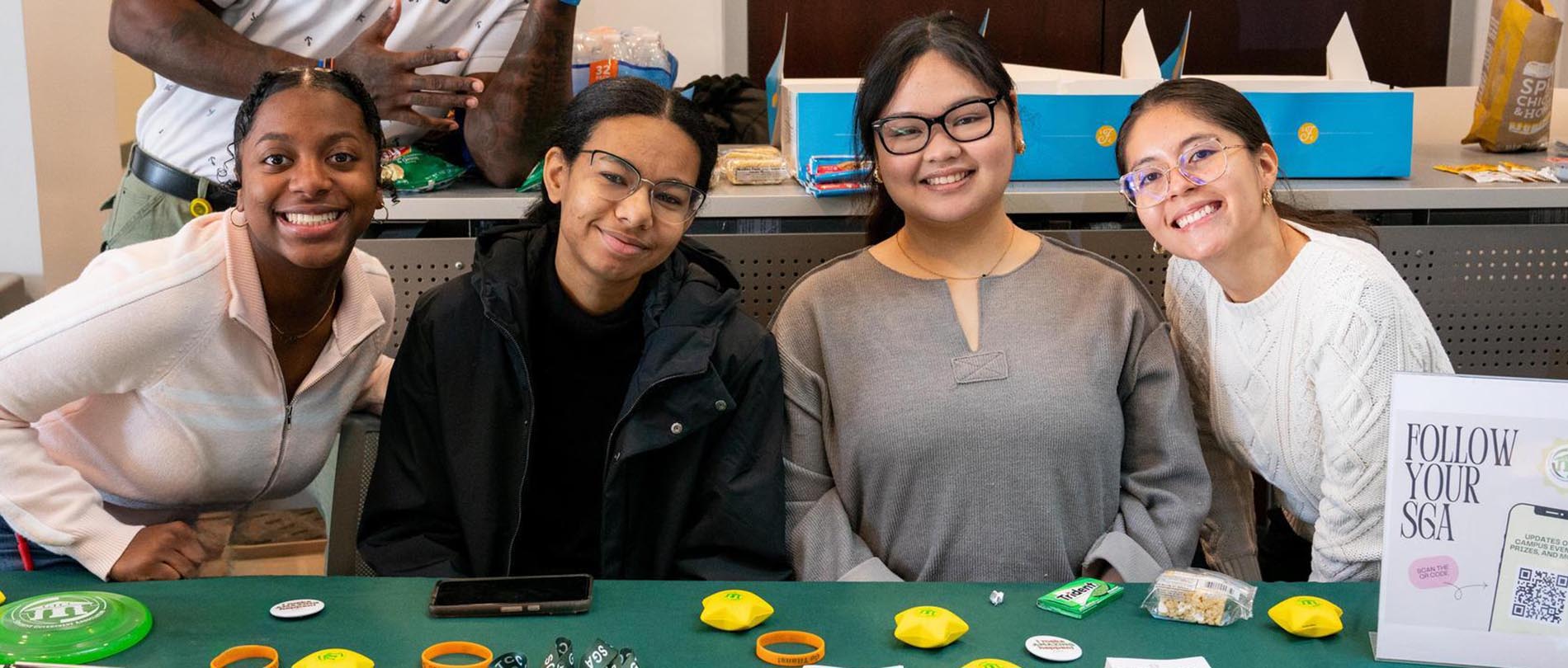 Four members of the Student Government Association at a table