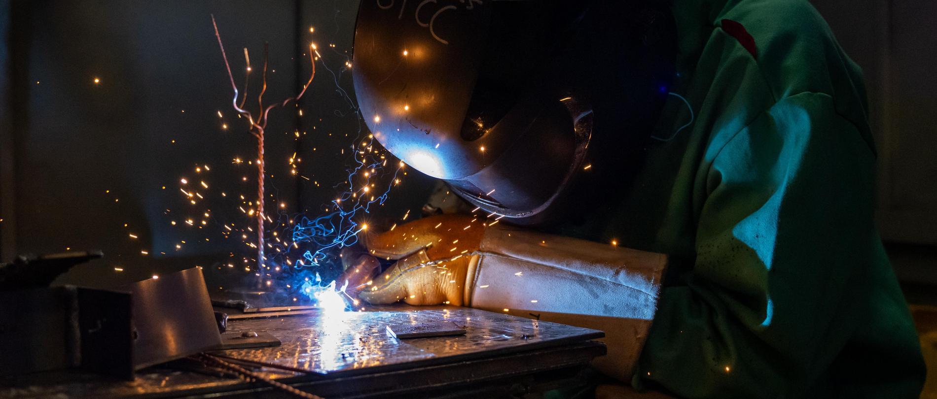 GTCC welding student welding with protective welding gear on