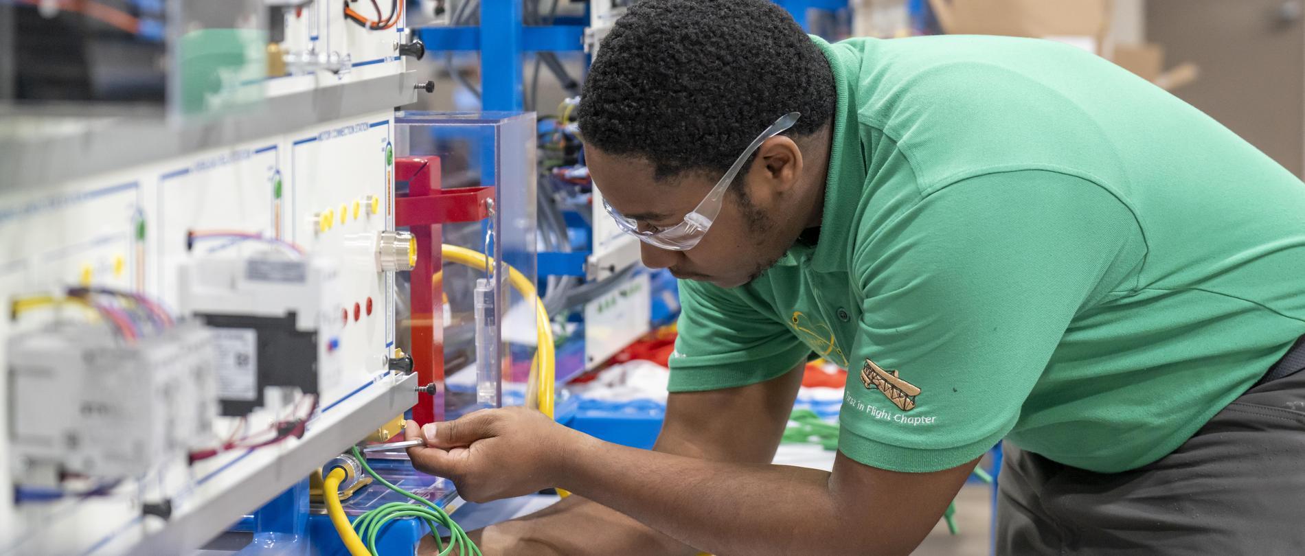 GTCC student working on electronics