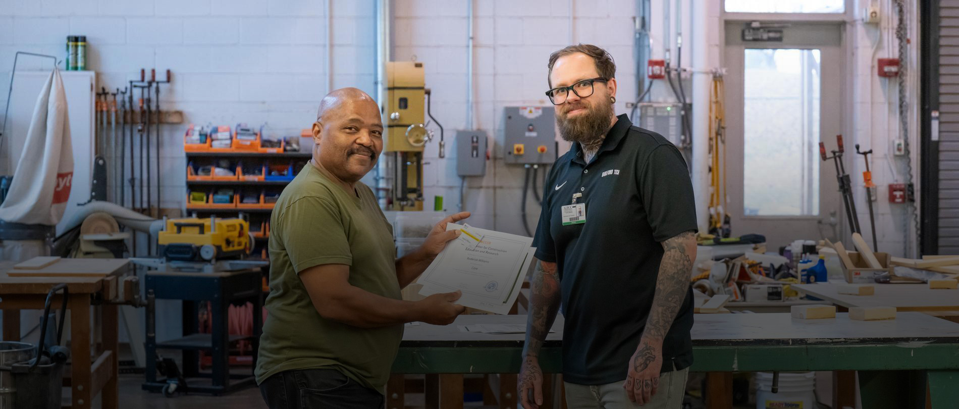 A GTCC instructor and a GTCC adult male student standing in a workshop