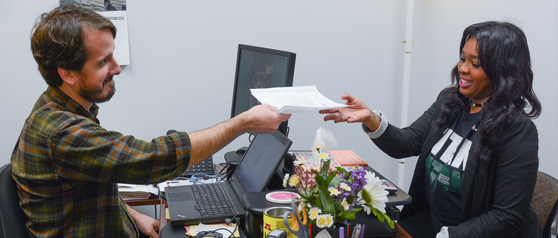 Student works with financial aid adviser