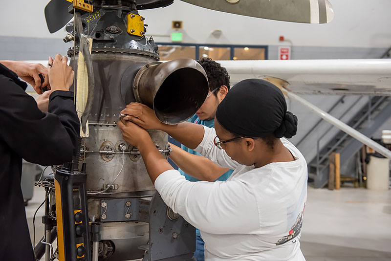 Students work on a propeller assembly.