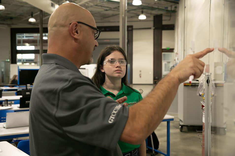 Instructor Jeff Wyco teaches FAME student Noel Carmac.