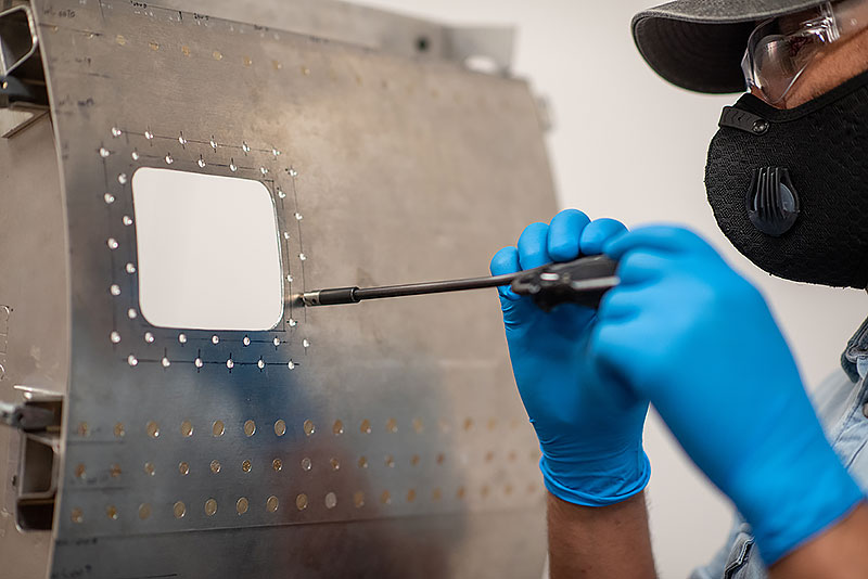 Student using bench shear