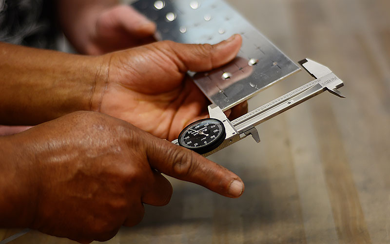 Student using a caliper