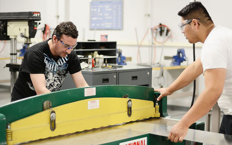 Students cutting aluminum