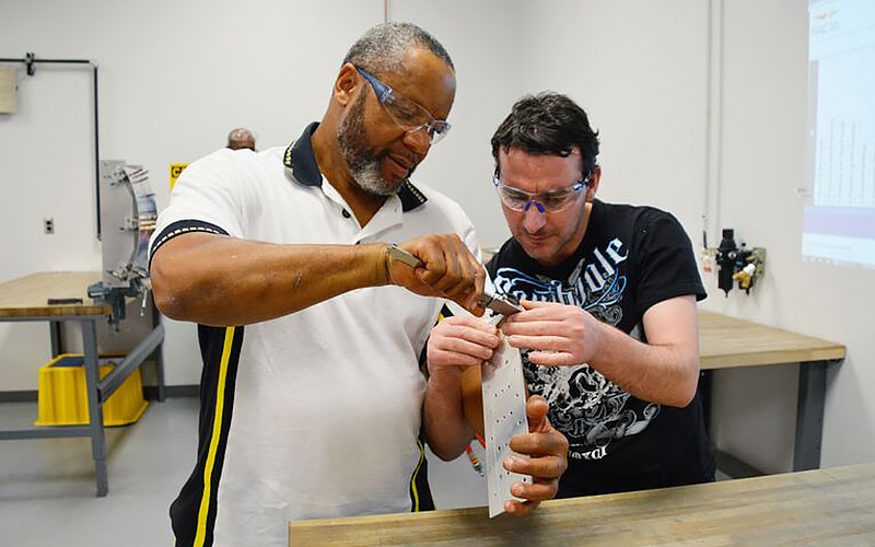 Students measuring material thickness