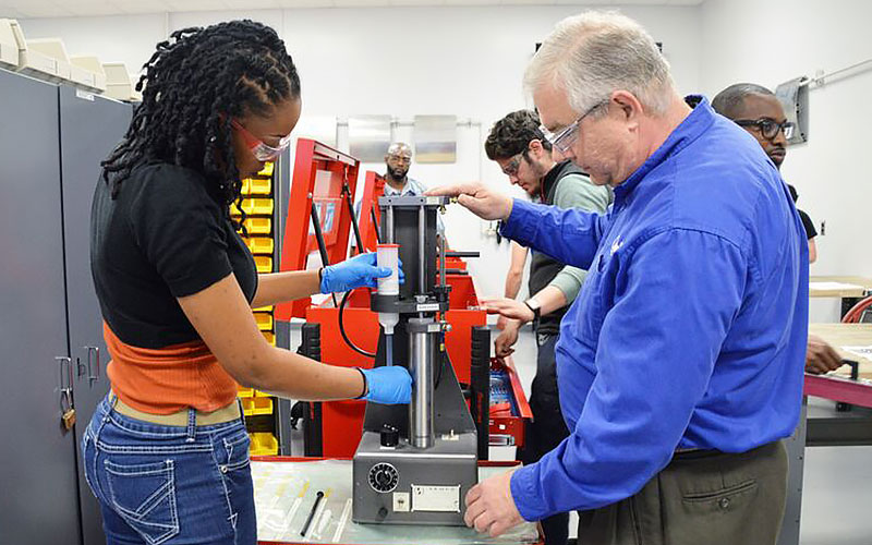 Students mixing sealant