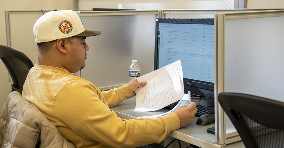 A student uses a computer at the Center for Academic Engagement.