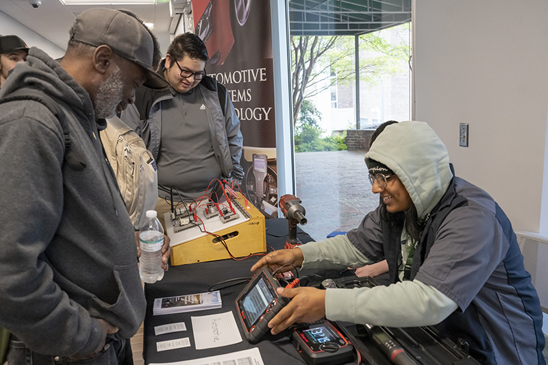 An automotive student present an exhibition