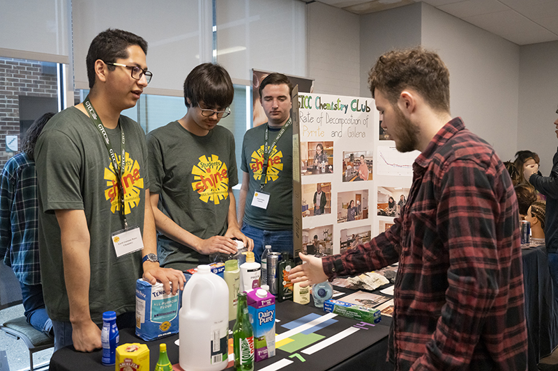 Chemistry students explain their exhibit at the 2024 Student Shine Presentation Day.