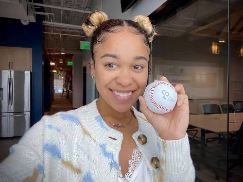 Niyah Webb holds a baseball.