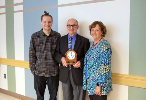 Mark Wheeler (center) with wife, Vicky (right), and son, Paul.