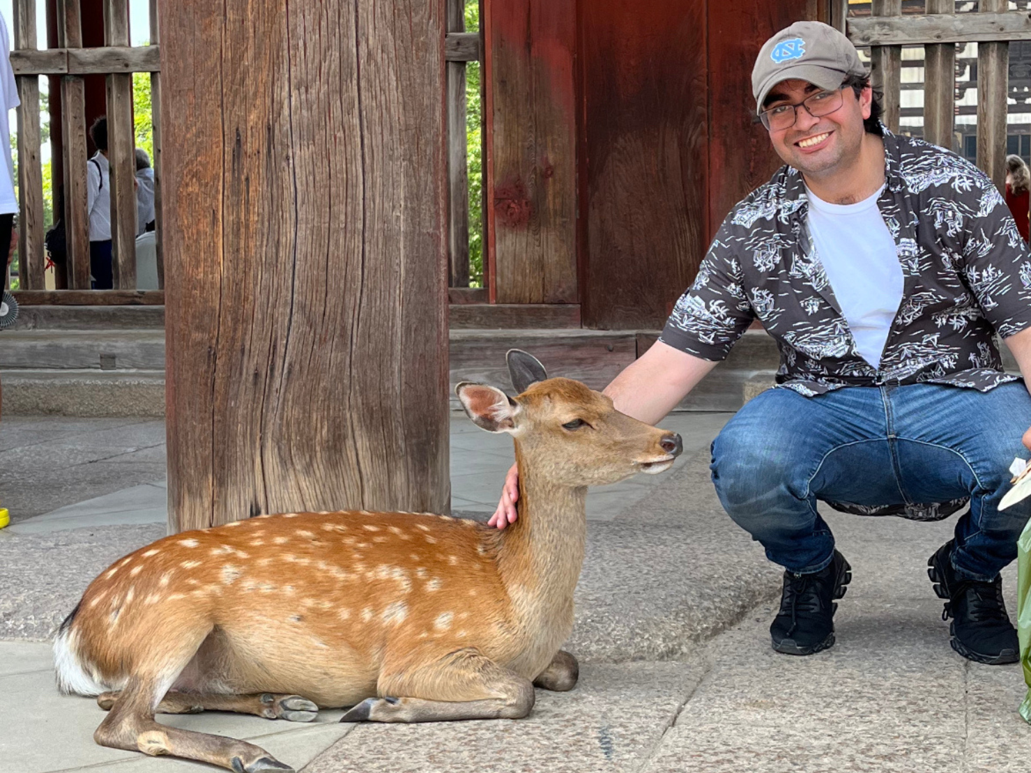 Neil Sharma poses with a deer.