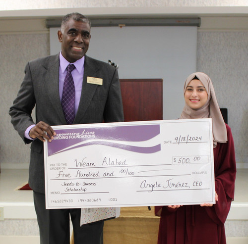 GTCC High Point Campus dean Dean Campbell, Ph.D., and Weam Alabed at the Housing Authority of the City of High Point scholarship ceremony.