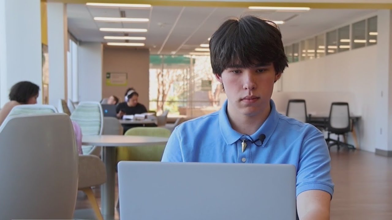 Benjamin Kivett working on laptop