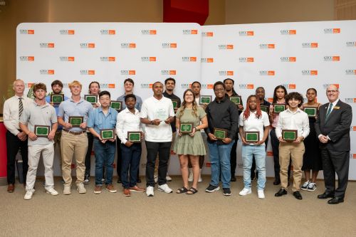 2025–26 GTCC athletic and academic award winners pose for a photo, including (far left) GTCC Athletic Director Kirk Chandler and (far right) GTCC President Anthony Clarke.